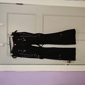 Tripp New York City black pants, with purple, zippers and buckles.